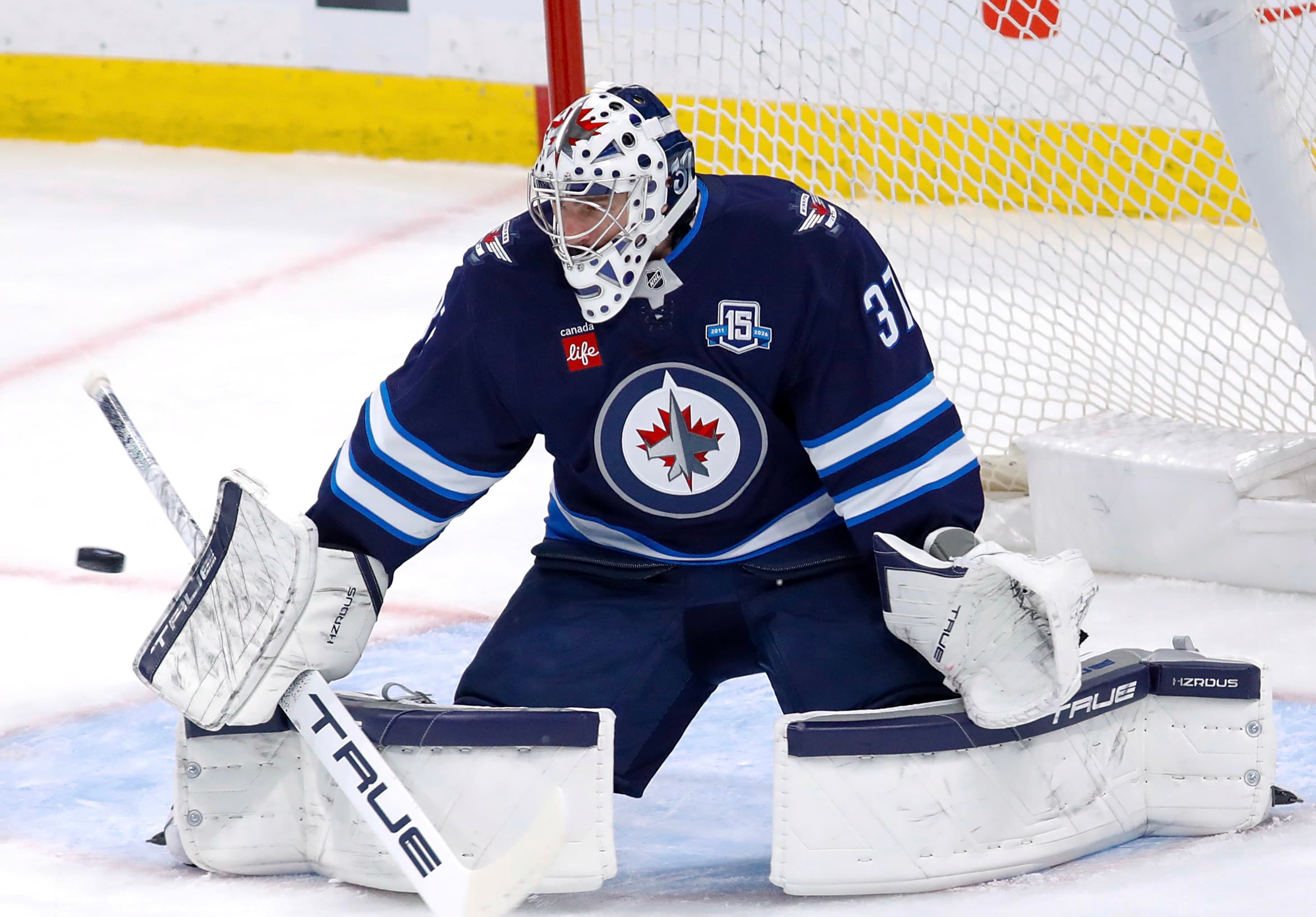 WHILE DEMANDING TRADE, JEts suspend hellebuyck for not reporting to camp